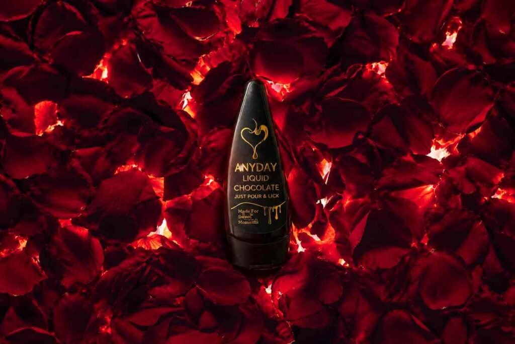 Looking for the Perfect Couple Chocolate? Meet a New Kind of Date-Night Experience 1 Bottle of Anyday ready-to-pour liquid couple chocolate on a romantic date night table
